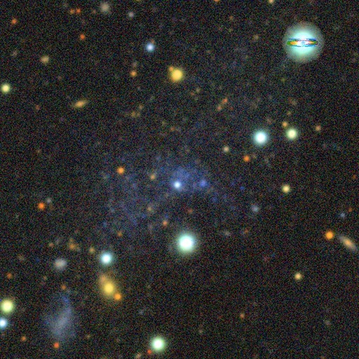 Pavo in DESI Legacy Surveys imaging. The blue knots are young stars; the faint red haze that extends much further is the ancient stellar population.